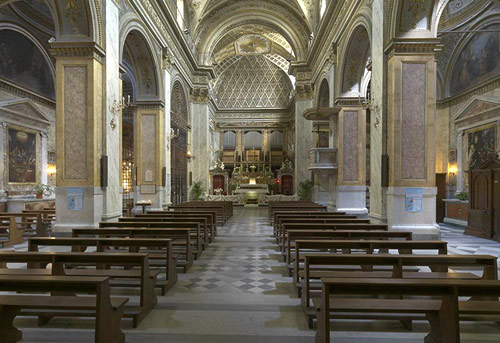Inside the church. The shrine is located at a side altar obscured at the left.