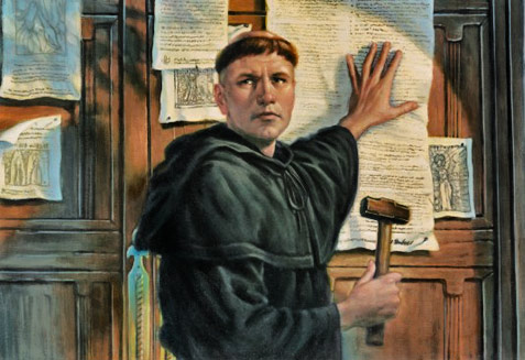 The monk Martin Luther nailing his theses on cathedral door in 1517